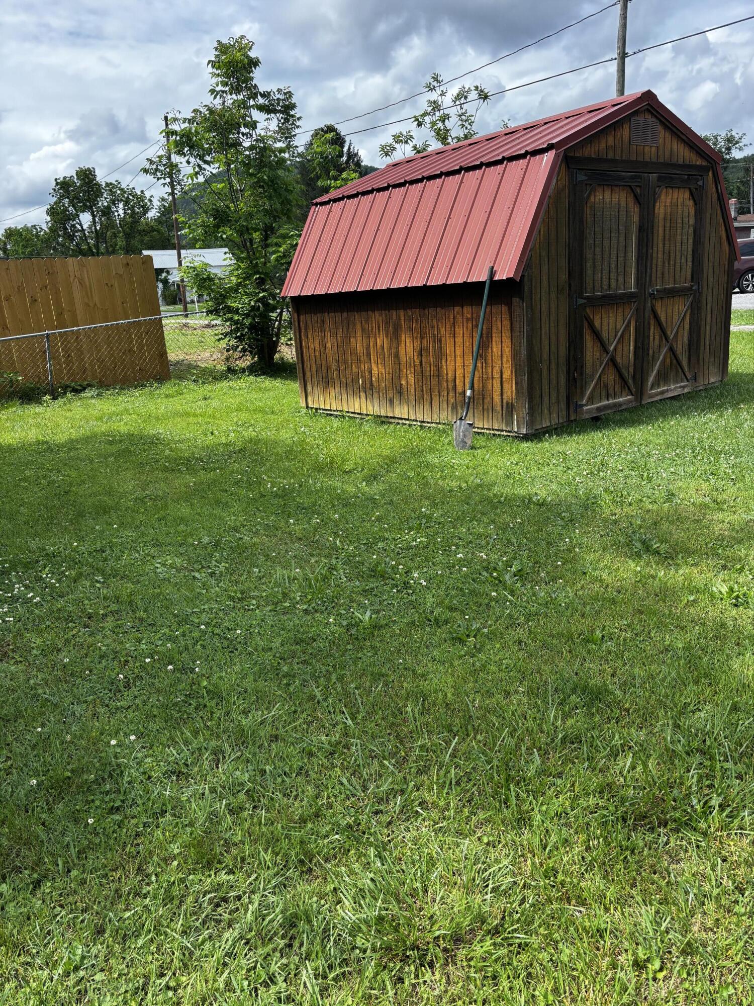 710 Commerce Avenue Iron Gate, VA 24448 - Photo 2 of 6 a house view with a garden space