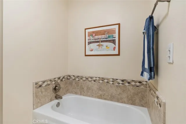 a bathroom with a bathtub and a sink