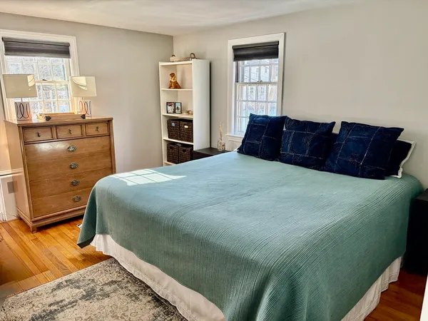 a bedroom with a bed and dresser
