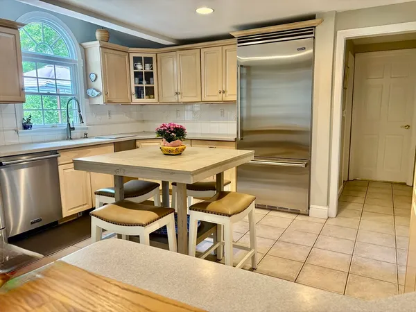 a kitchen with a sink cabinets and window