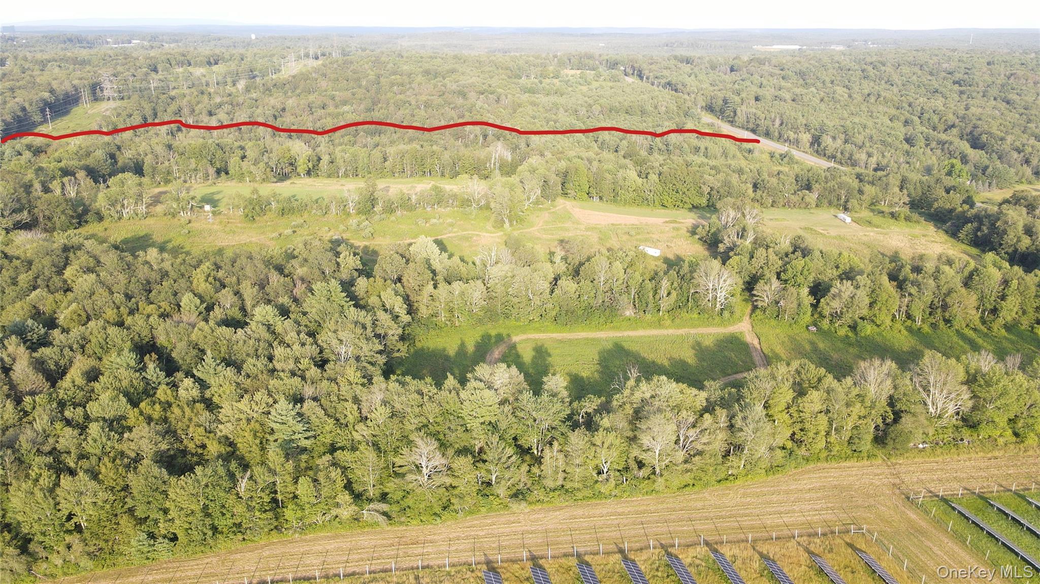 150 Sackett Lake Road Monticello, NY 12701 - Photo 8 of 10 a view of a lake with a mountain in the background