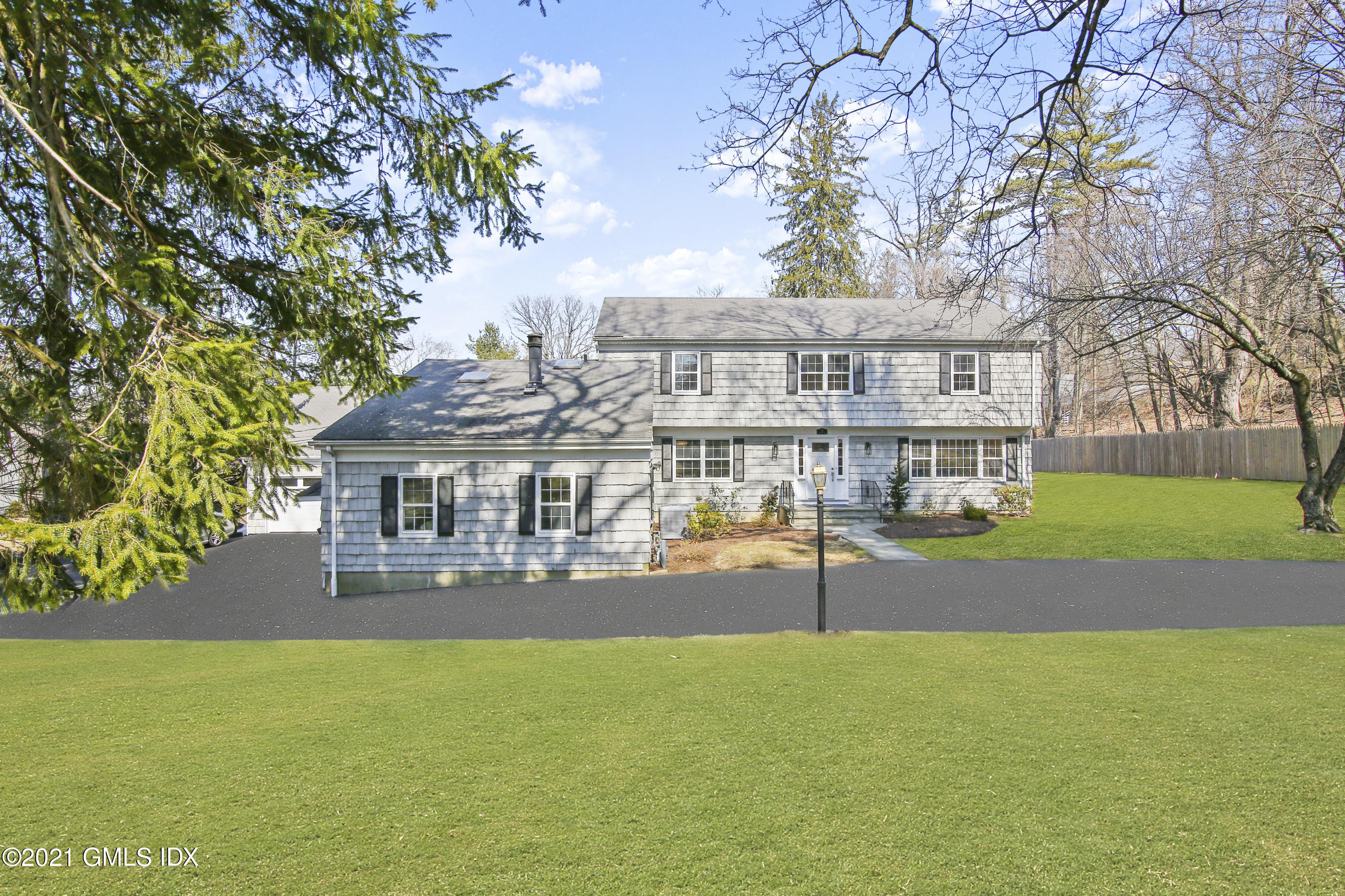 a view of house with a garden