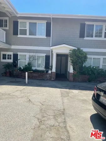 a swimming pool view with a seating space