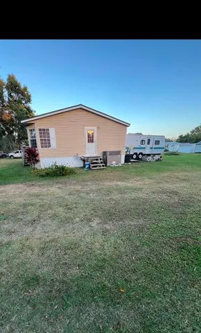 a view of a field with of trees