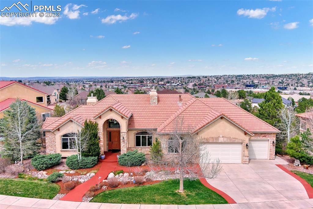 a aerial view of a house with a yard