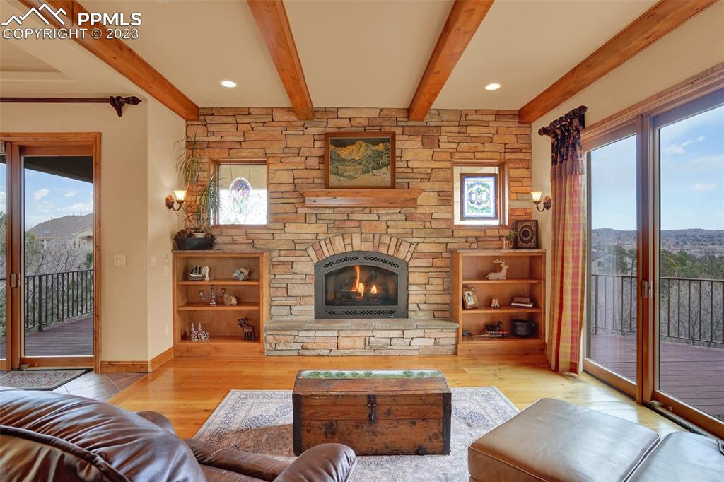 4655 Seton Hall Road Colorado Springs, CO 80918 - Photo 11 of 50 a living room with furniture and a fireplace