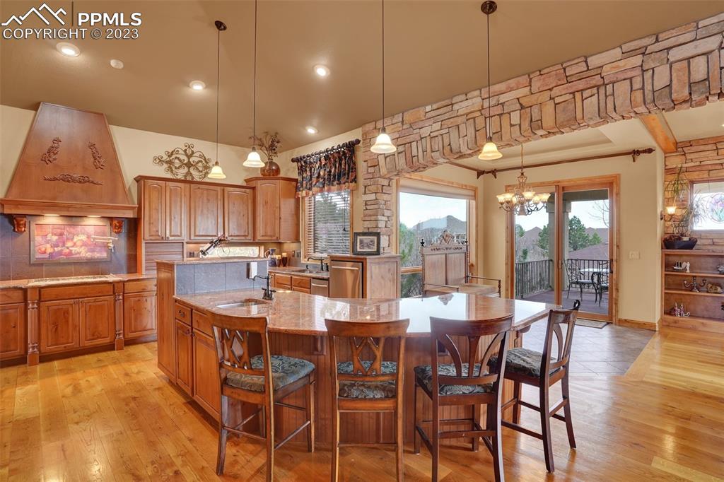 4655 Seton Hall Road Colorado Springs, CO 80918 - Photo 17 of 50 a large kitchen with a table and chairs