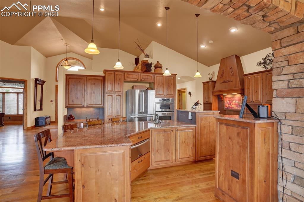 4655 Seton Hall Road Colorado Springs, CO 80918 - Photo 20 of 50 a large kitchen with a large counter top appliances and cabinets