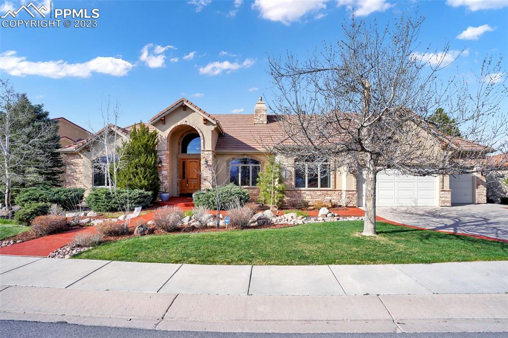 4655 Seton Hall Road Colorado Springs, CO 80918 - Photo 2 of 50 a front view of house with yard