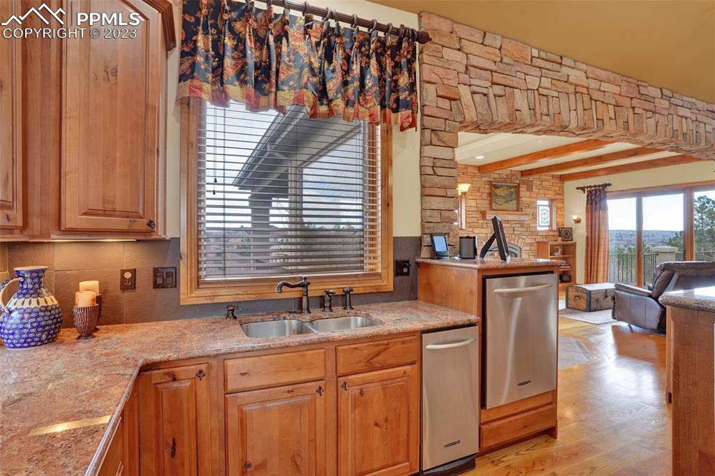 4655 Seton Hall Road Colorado Springs, CO 80918 - Photo 21 of 50 a kitchen with sink refrigerator and large window