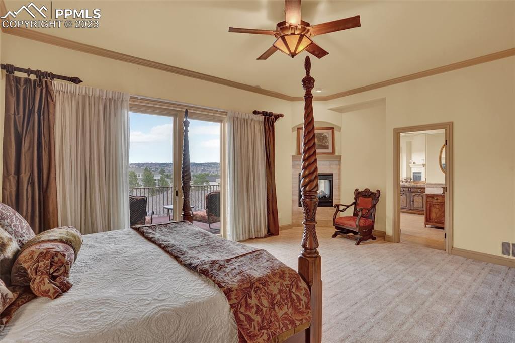 4655 Seton Hall Road Colorado Springs, CO 80918 - Photo 25 of 50 a bedroom with a bed couch and a window