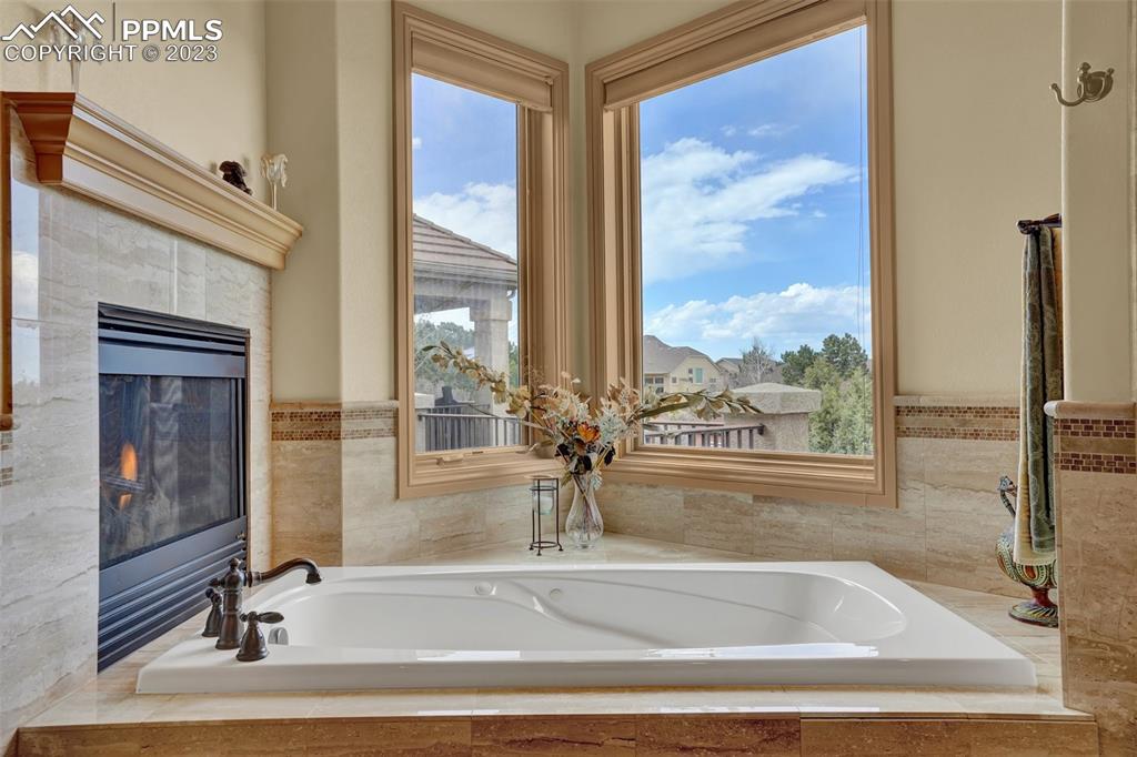 4655 Seton Hall Road Colorado Springs, CO 80918 - Photo 29 of 50 a view of a bathroom with tub and windows