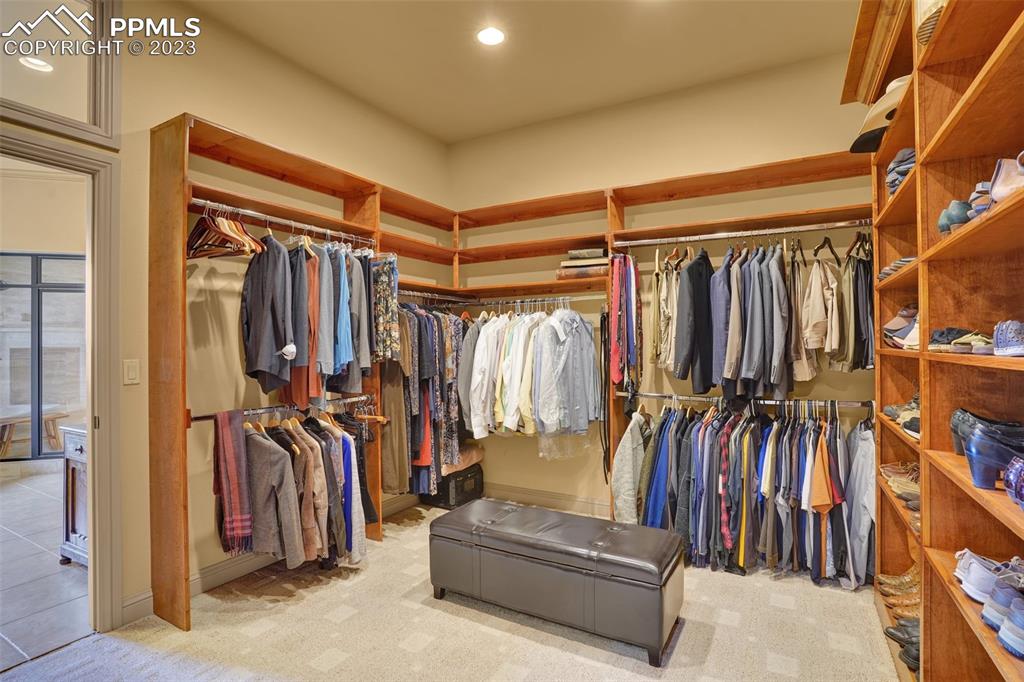 4655 Seton Hall Road Colorado Springs, CO 80918 - Photo 30 of 50 a view of walk in closet with clothes and shoes