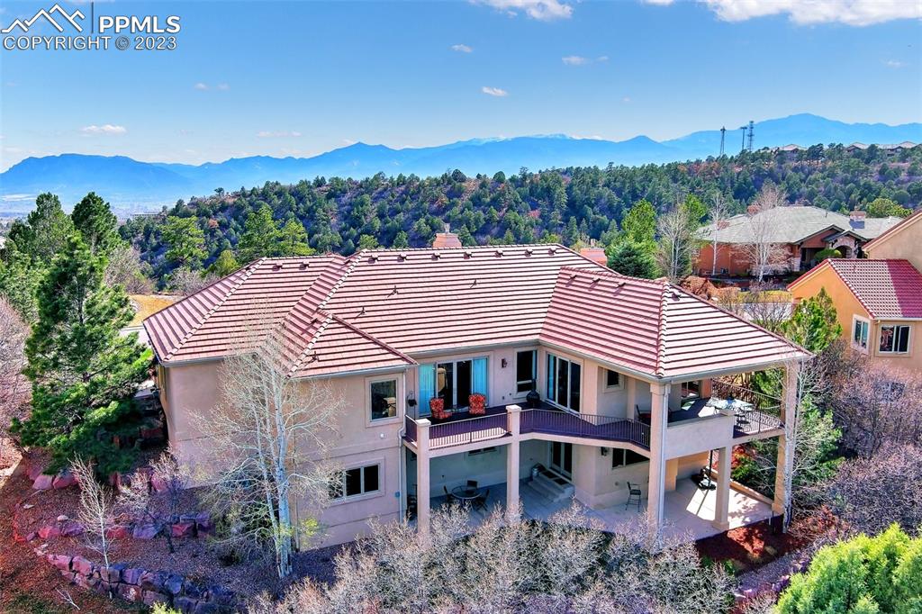4655 Seton Hall Road Colorado Springs, CO 80918 - Photo 4 of 50 aerial view of a house with a yard and balcony
