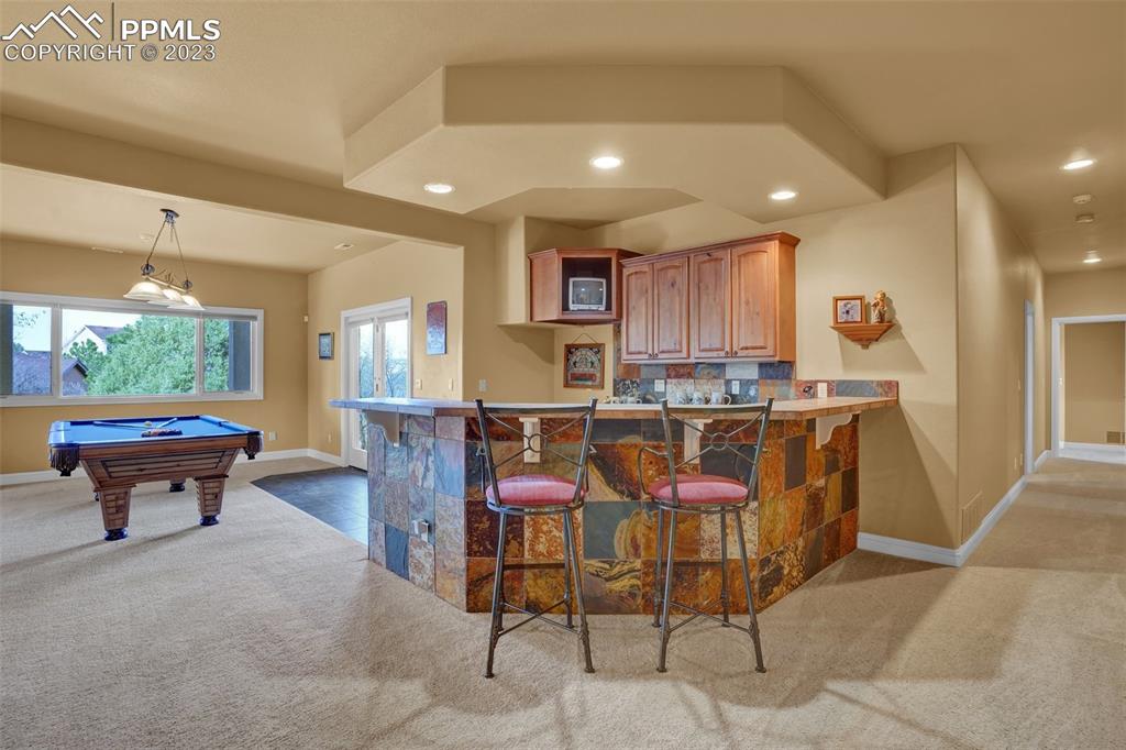 4655 Seton Hall Road Colorado Springs, CO 80918 - Photo 43 of 50 a living room with furniture and a large window