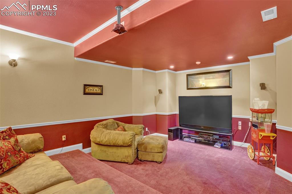 4655 Seton Hall Road Colorado Springs, CO 80918 - Photo 46 of 50 a living room with furniture and a flat screen tv