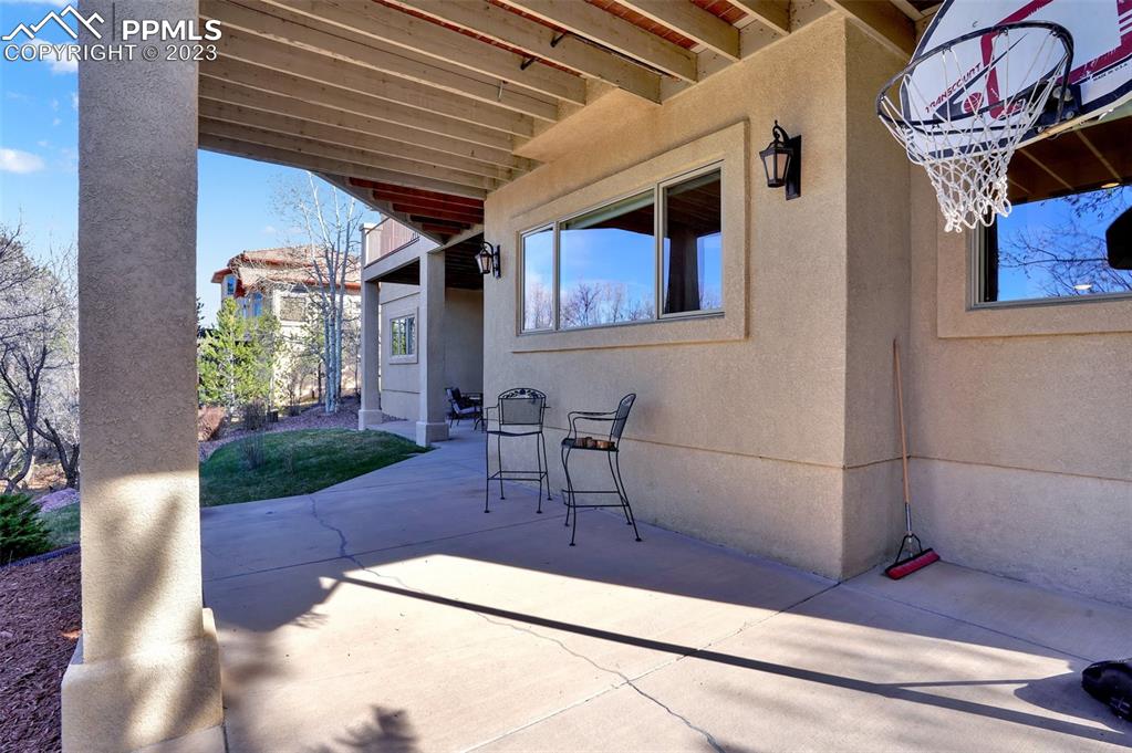 4655 Seton Hall Road Colorado Springs, CO 80918 - Photo 49 of 50 a view of a patio with table and chairs and potted plants