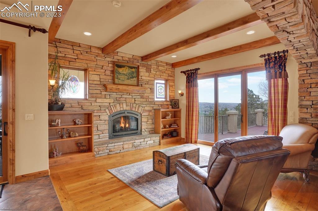 4655 Seton Hall Road Colorado Springs, CO 80918 - Photo 10 of 50 a living room with furniture and a fireplace