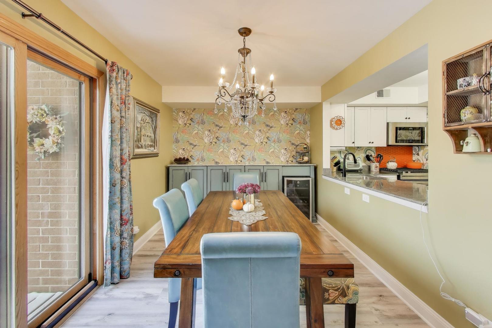2235 North Lakewood Avenue, Unit FN Chicago, IL 60614 - Photo 16 of 41 a view of a dining room with furniture and chandelier
