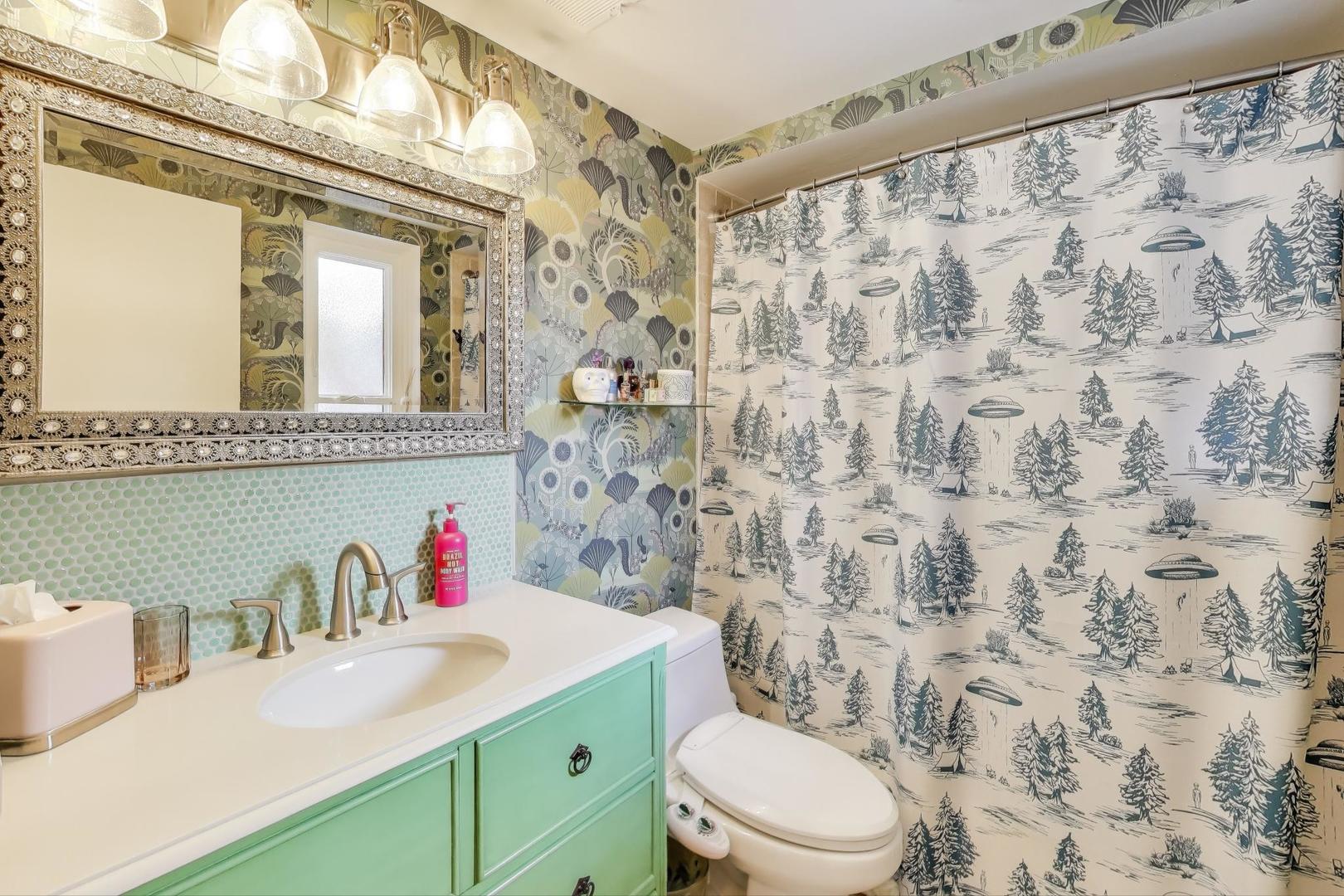 2235 North Lakewood Avenue, Unit FN Chicago, IL 60614 - Photo 23 of 41 a bathroom with a sink and a mirror