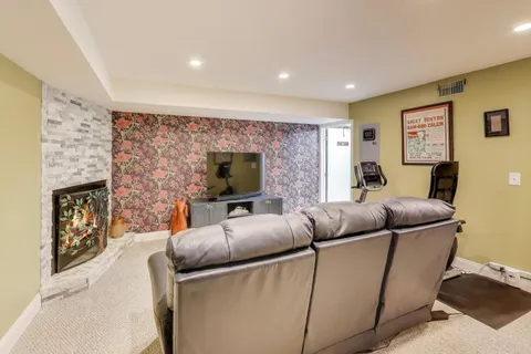 a living room with furniture a couch and a flat screen tv