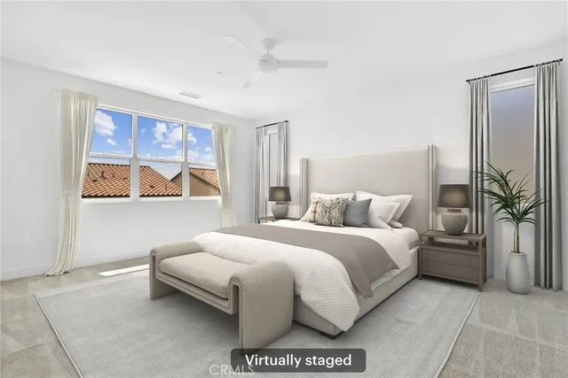 a bedroom with a bed lamp and a window