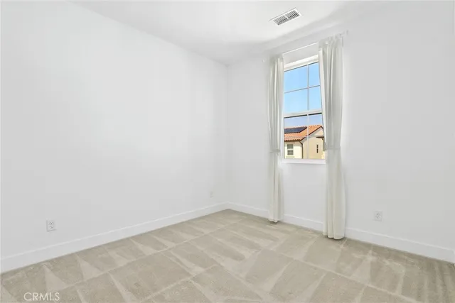 an empty room with closet area