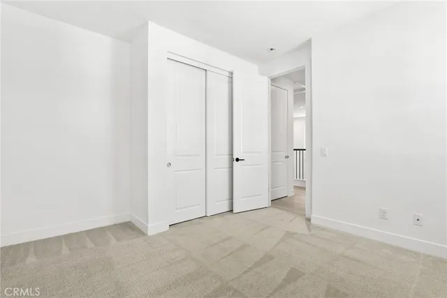 a white bath tub sitting next to a toilet