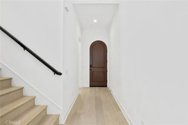 a view of entryway with wooden floor