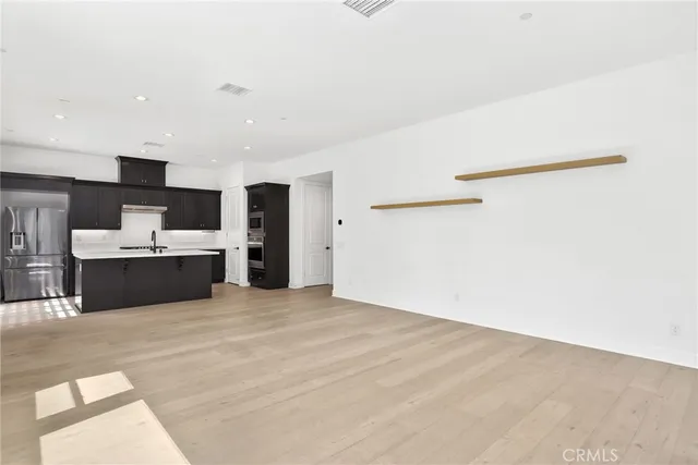 a view of a kitchen with a sink