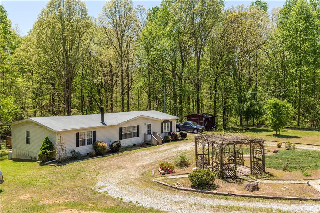 7596 Tribble Gap Road Alto, GA 30510 - Photo 1 of 1 a house view with a sitting space and garden space