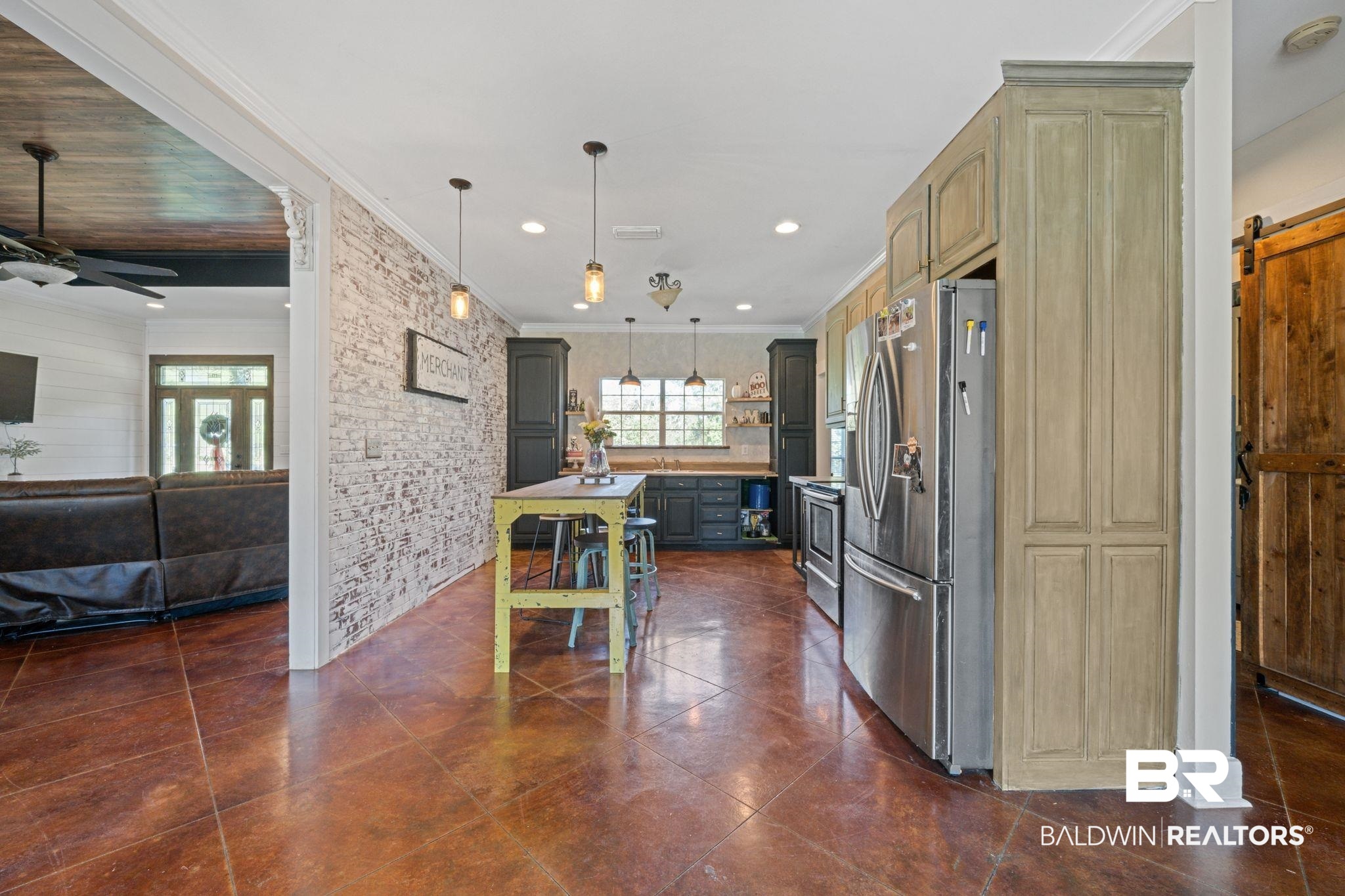 15635 North A N Brady Road Bay Minette, AL 36507 - Photo 17 of 51 Kitchen with hanging light fixtures, a barn door, a kitchen island, stainless steel appliances, and ceiling fan