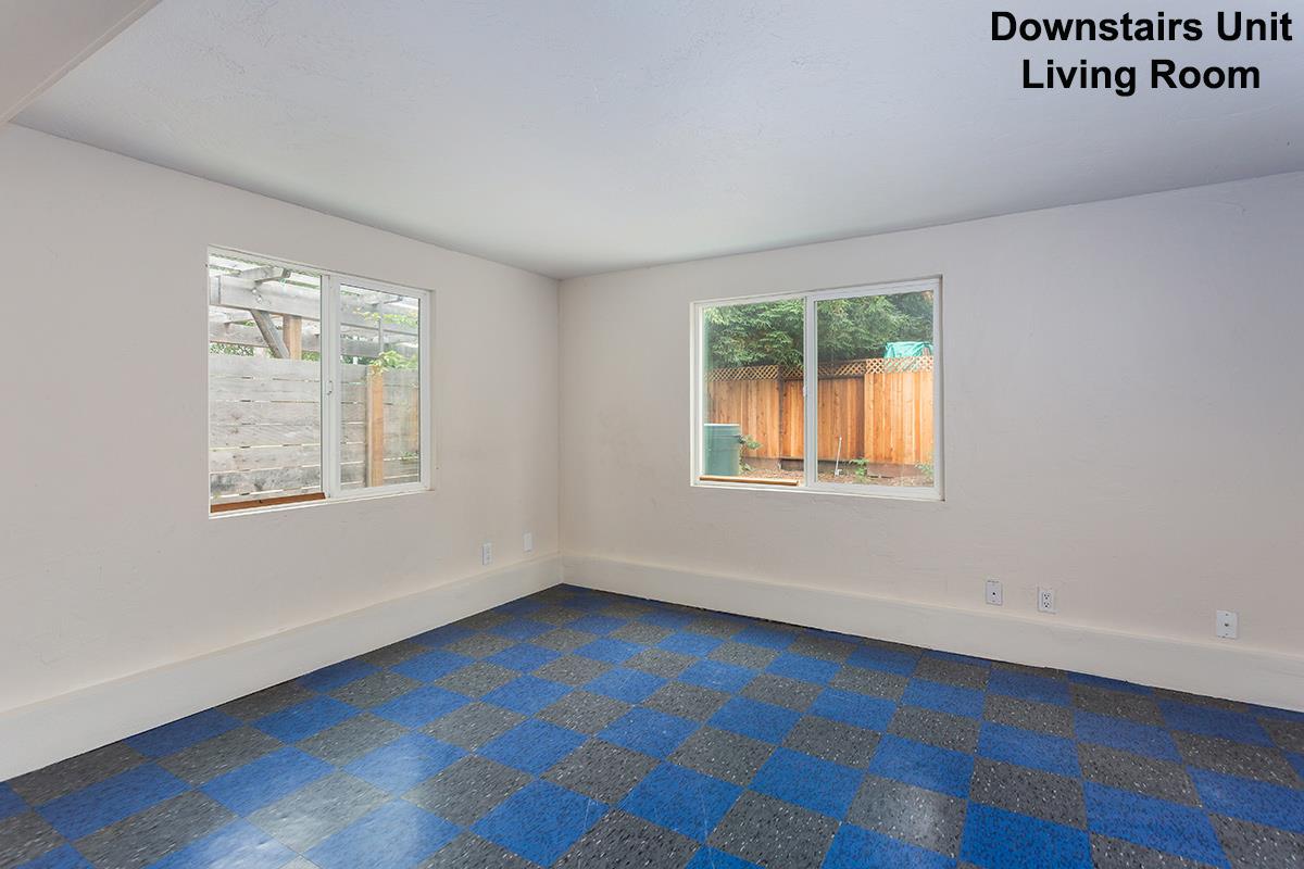 631 Riverside Avenue Santa Cruz, CA 95060 - Photo 14 of 25 a view of an empty room with wooden floor and a window