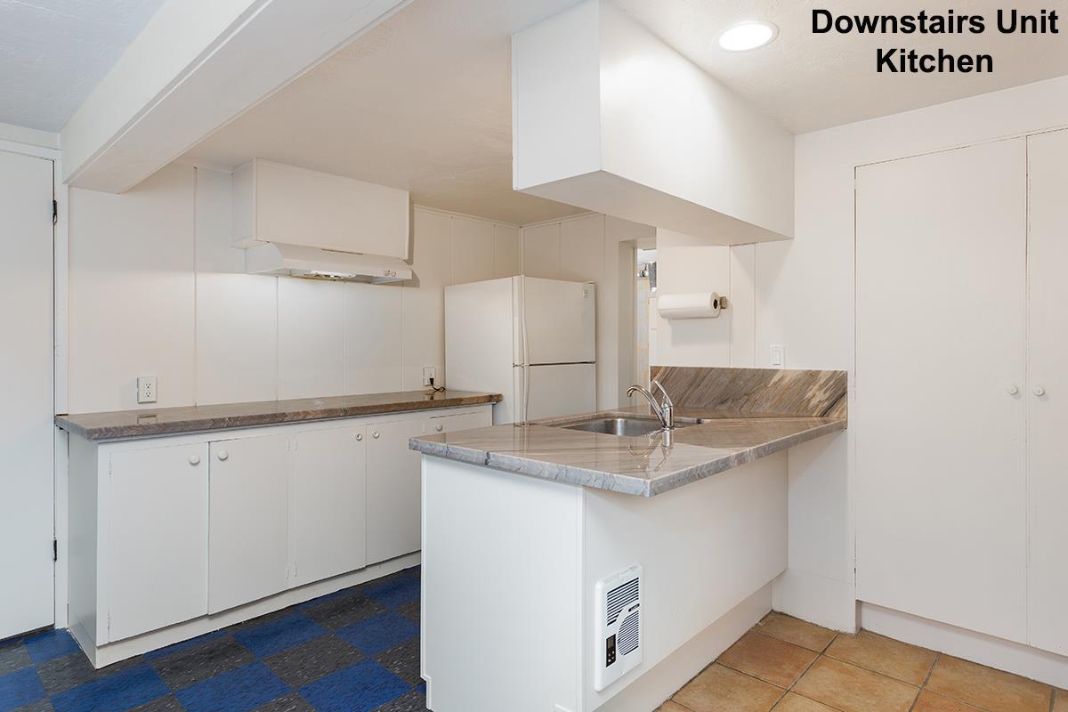 631 Riverside Avenue Santa Cruz, CA 95060 - Photo 15 of 25 a kitchen with a sink a mirror and cabinets