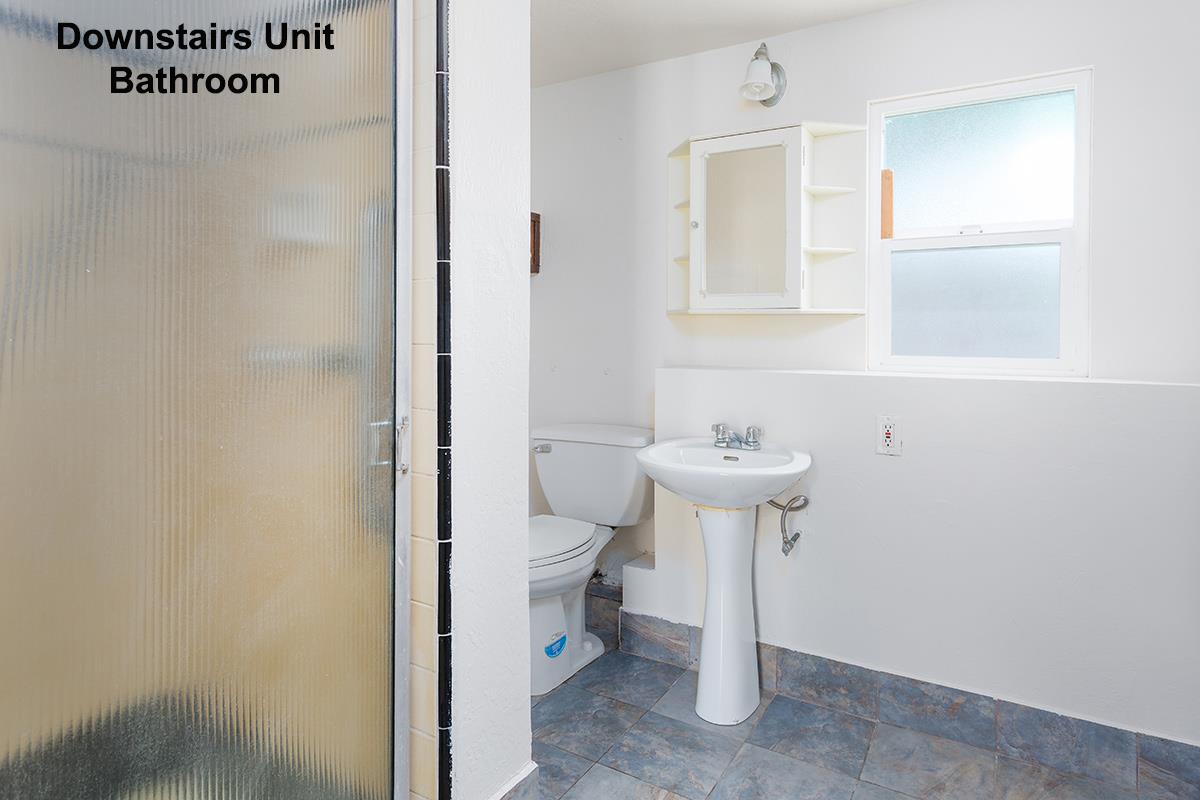 631 Riverside Avenue Santa Cruz, CA 95060 - Photo 16 of 25 a bathroom with a sink a toilet and mirror