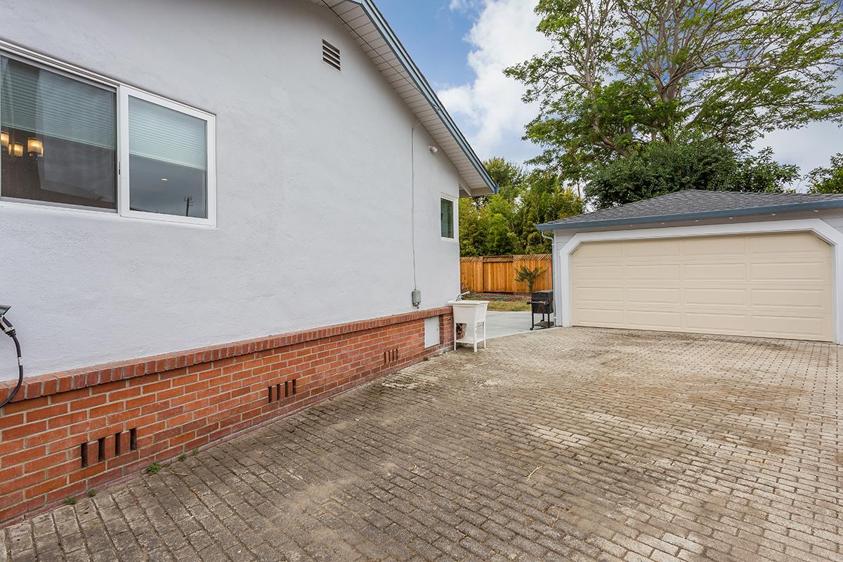 631 Riverside Avenue Santa Cruz, CA 95060 - Photo 22 of 25 a backyard of a house with wooden fence and trees