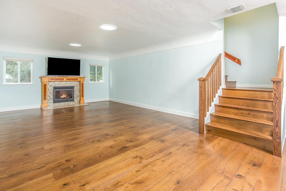 631 Riverside Avenue Santa Cruz, CA 95060 - Photo 8 of 25 a view of a livingroom with wooden floor and a flat screen tv