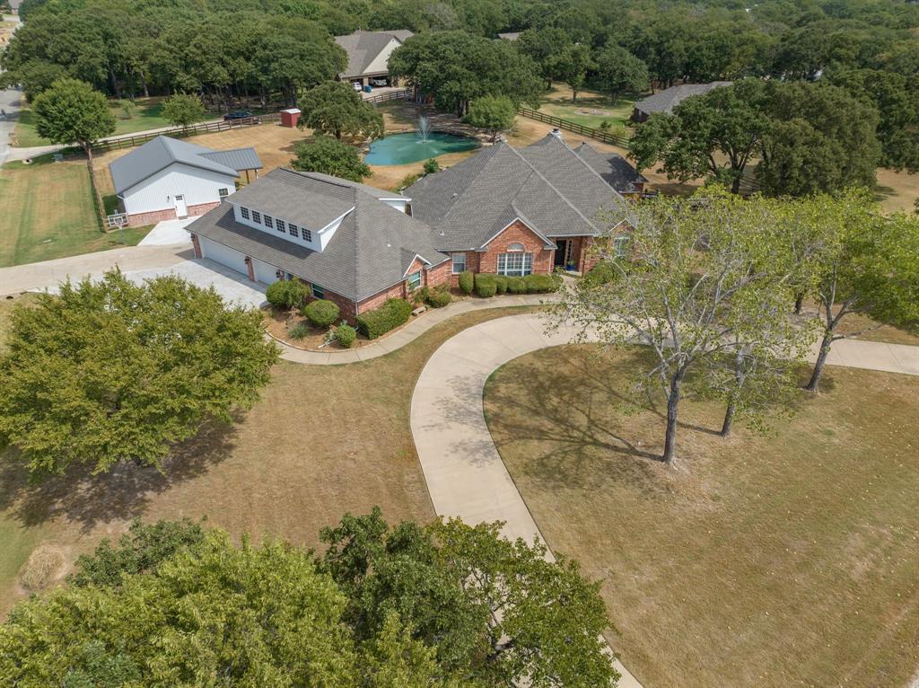 1022 Cedar Creek Road Argyle, TX 76226 - Photo 1 of 1 an aerial view of residential house with outdoor space and trees all around