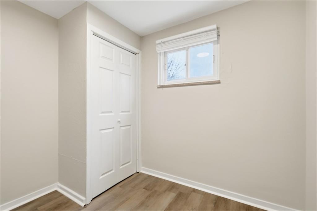 2446 Willowbrook Road Pittsburgh, PA 15241 - Photo 18 of 31 a view of an empty room with wooden floor