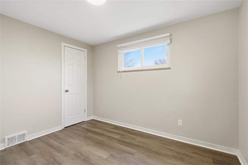 2446 Willowbrook Road Pittsburgh, PA 15241 - Photo 21 of 31 a view of an empty room with wooden floor
