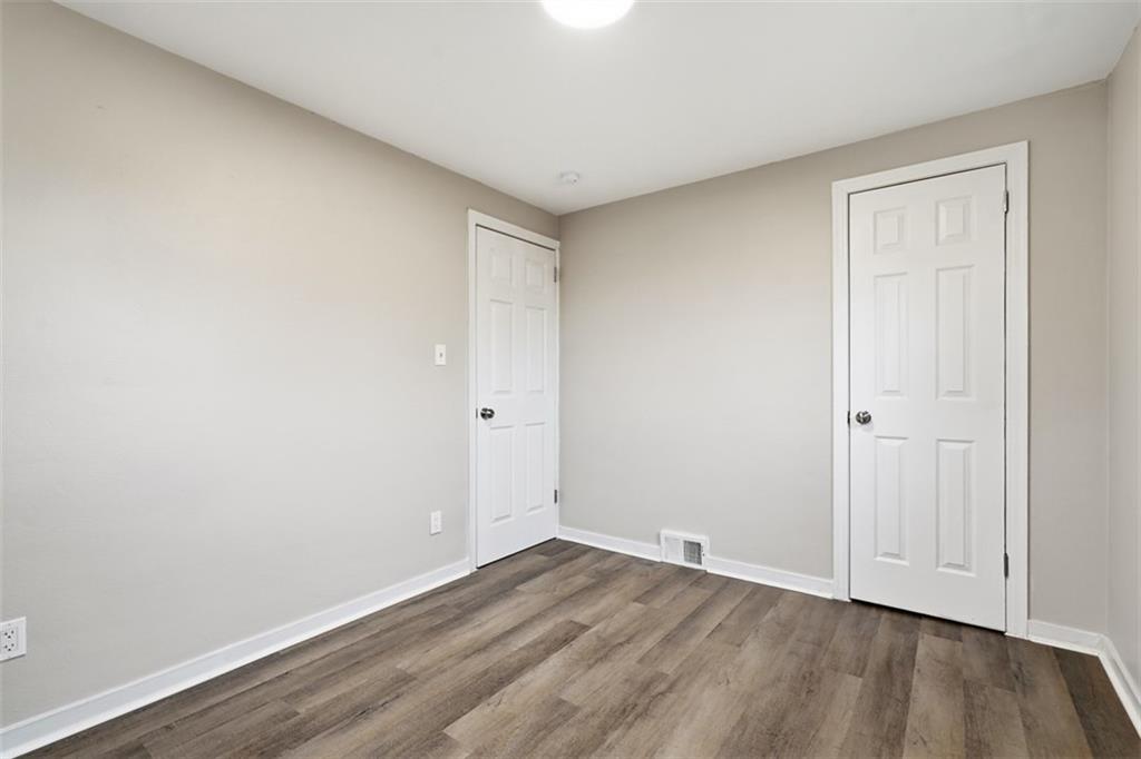 2446 Willowbrook Road Pittsburgh, PA 15241 - Photo 22 of 31 a view of an empty room with wooden floor