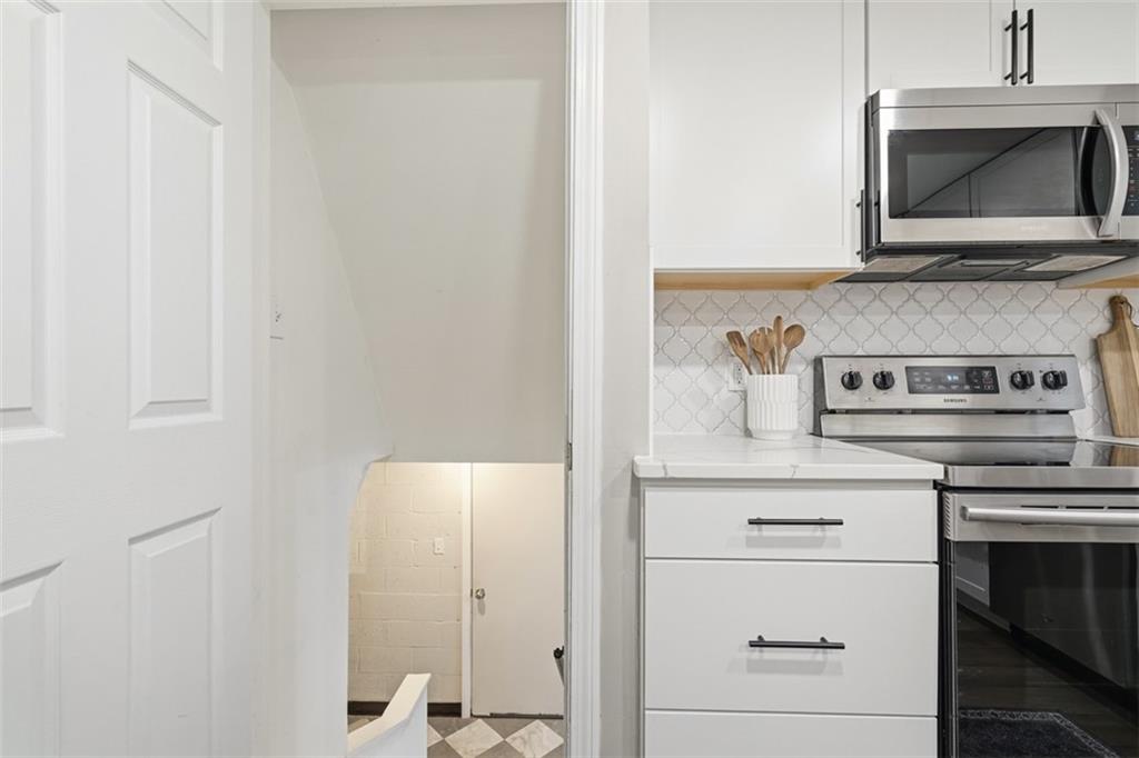 2446 Willowbrook Road Pittsburgh, PA 15241 - Photo 23 of 31 a kitchen with a stove and cabinets
