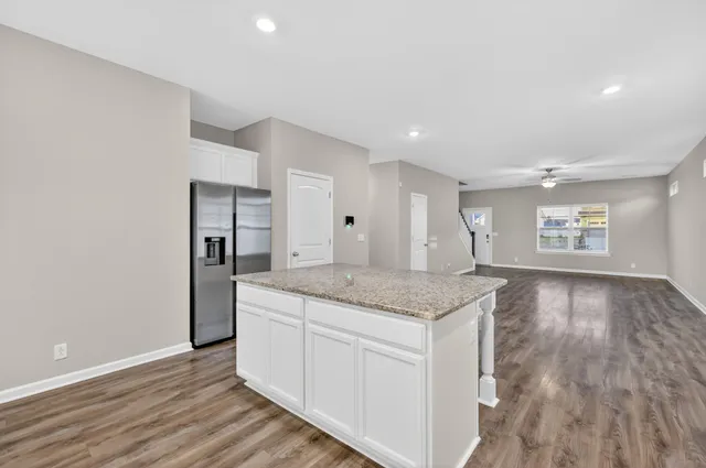 a kitchen with a sink and cabinet