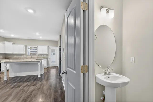 a bathroom with a sink double vanity and a mirror