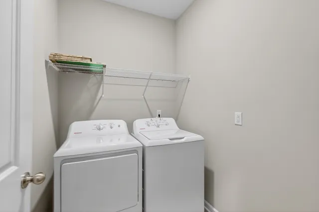 a utility room with dryer and washer