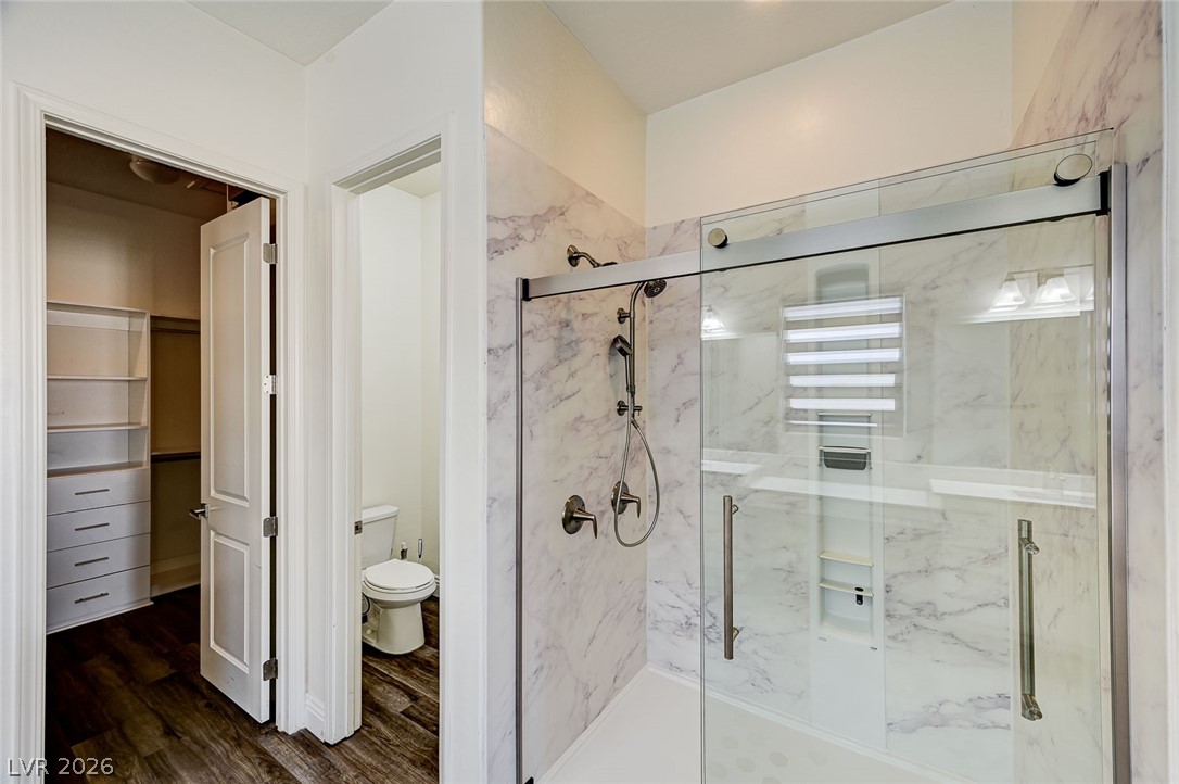 8197 Riley Love Street Las Vegas, NV 89139 - Photo 31 of 48 A well-appointed bathroom features a spacious shower and convenient walk-in closet access.