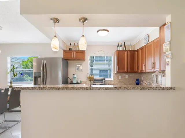 a view of a kitchen with a sink and a window