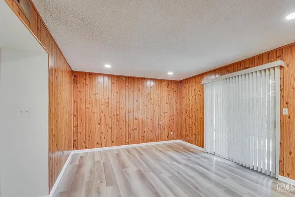 a view of hallway with wooden floor