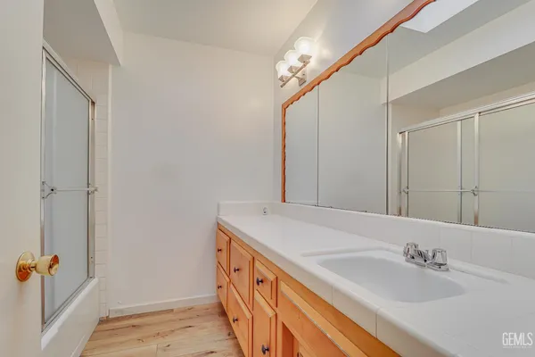a bathroom with a sink and a mirror
