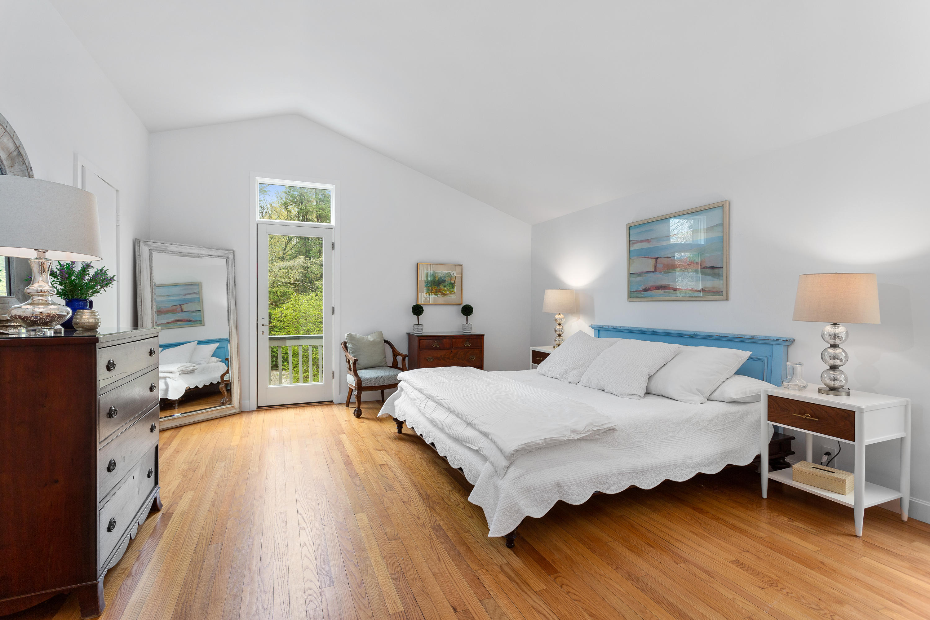 33 Point Road Norwalk, CT 06854 - Photo 14 of 29 a bedroom with a bed and wooden floor